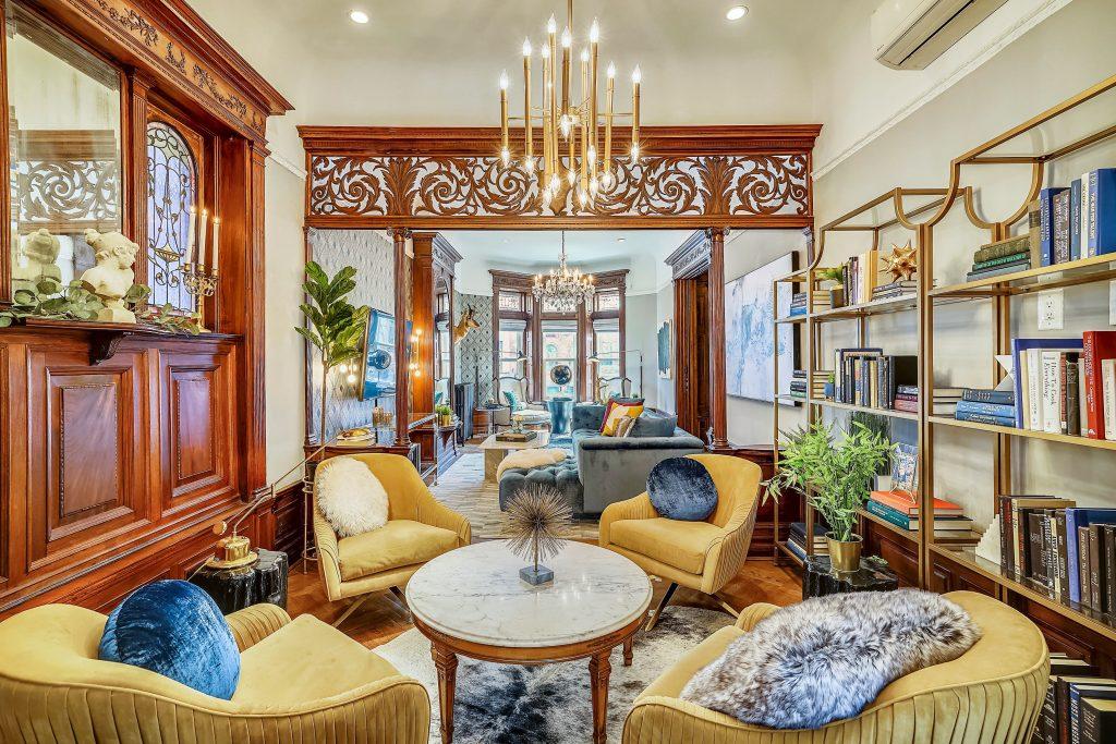 Queen Anne Victorian brownstone parlor with glam decor in our design interview